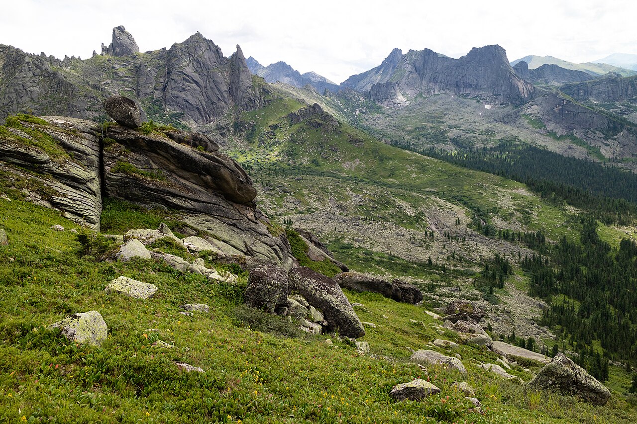 Mountain landscape with high dynamic range between bright sky and shadowed valley