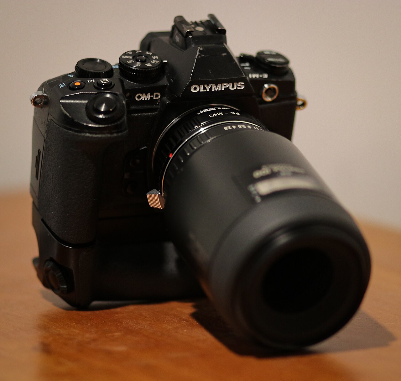 A manual-focus lens adapted onto a mirrorless camera