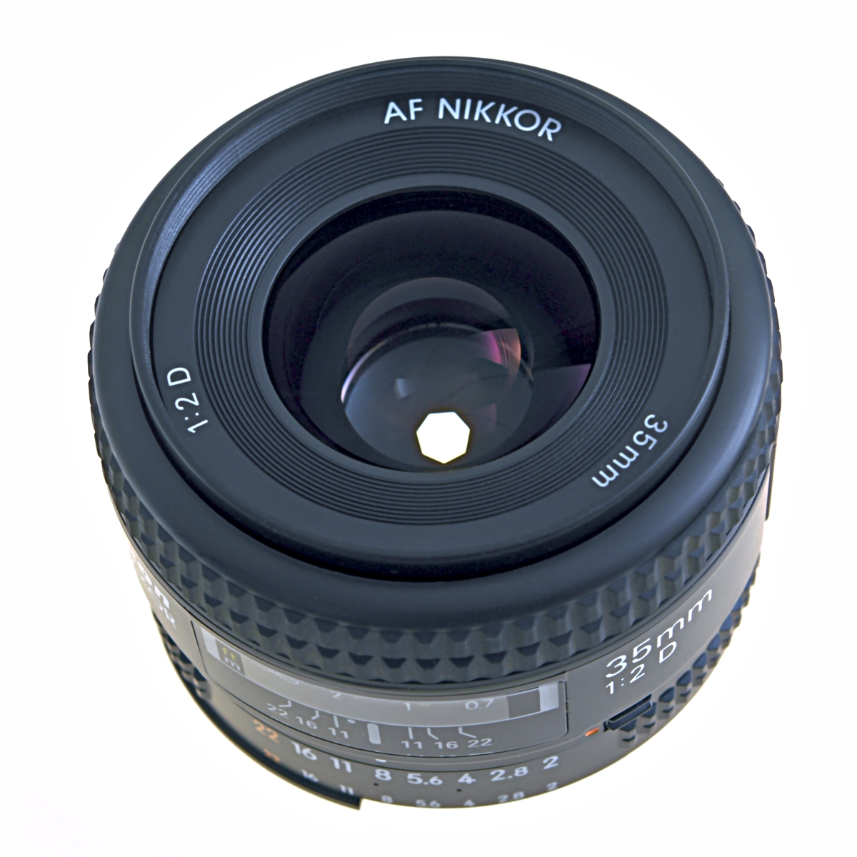 A close-up of a camera lens aperture made of overlapping blades