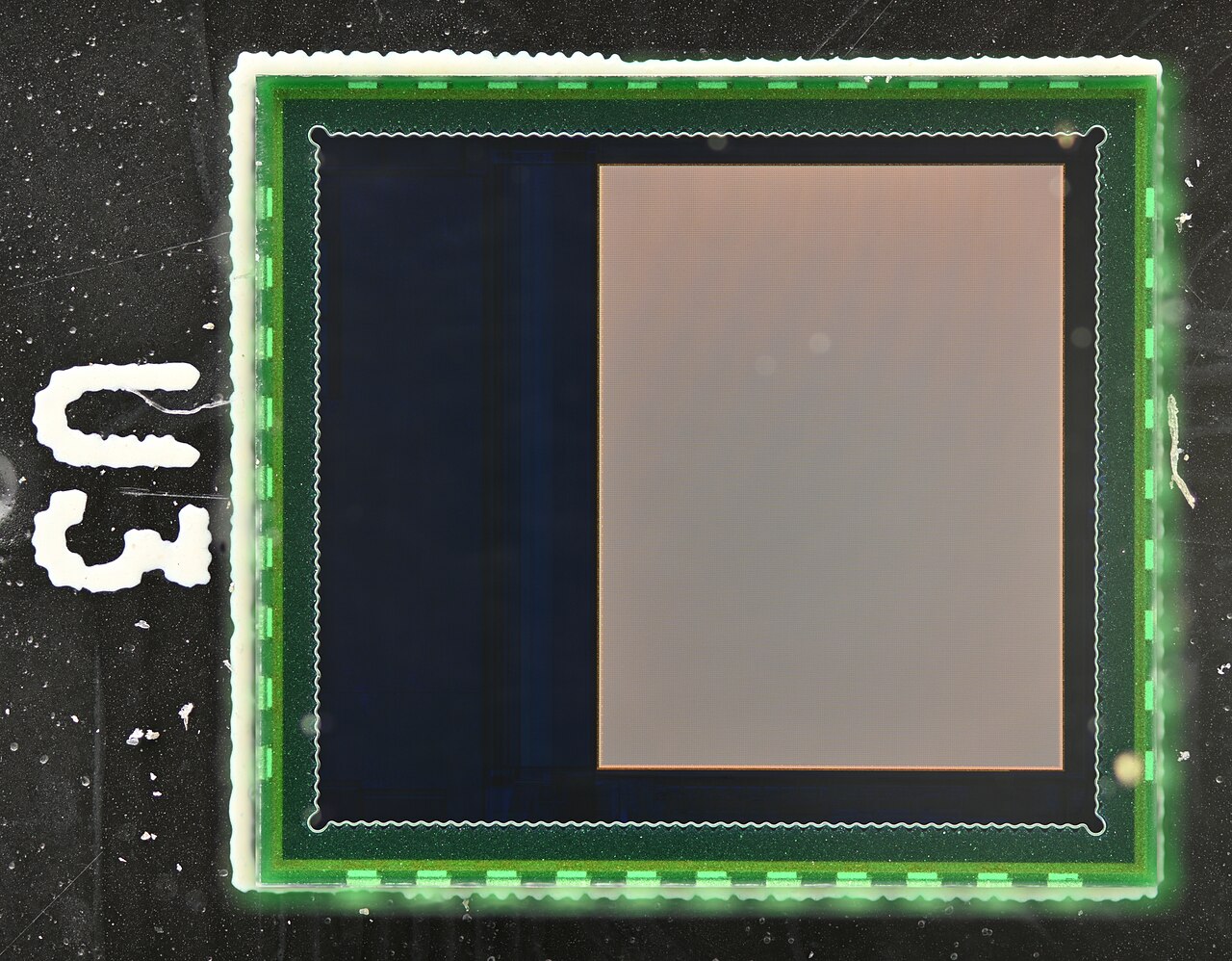 Top-down macro photograph of a CMOS image sensor chip