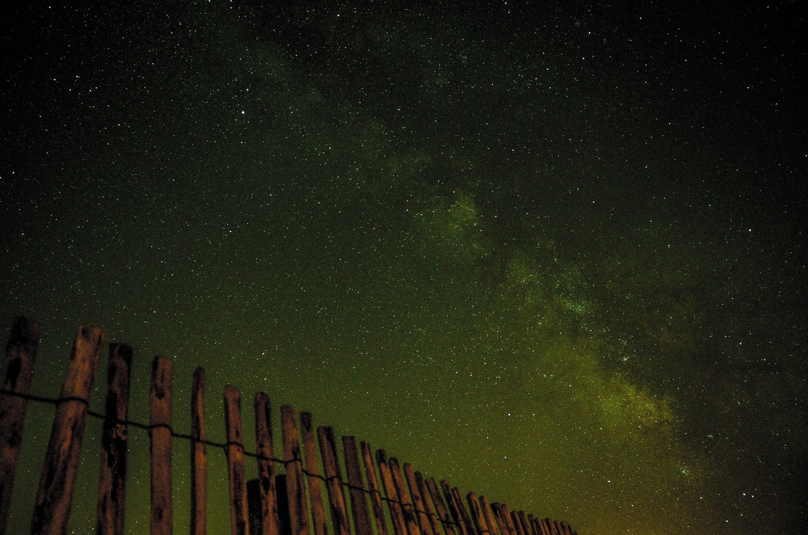 Milky Way galaxy over a night landscape