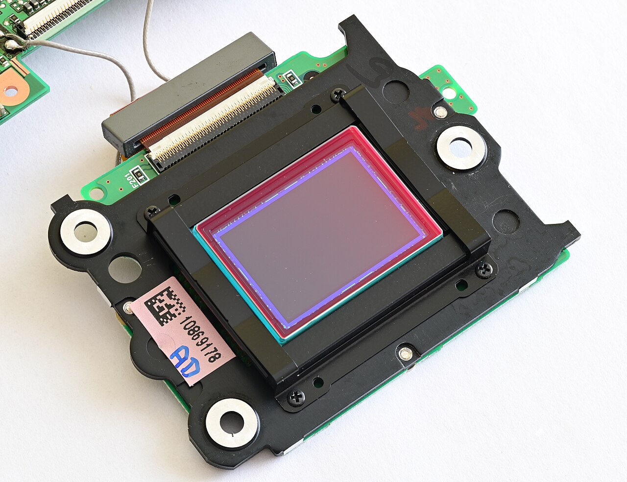 A camera sensor with its optical low-pass filter and hot mirror removed from the stack