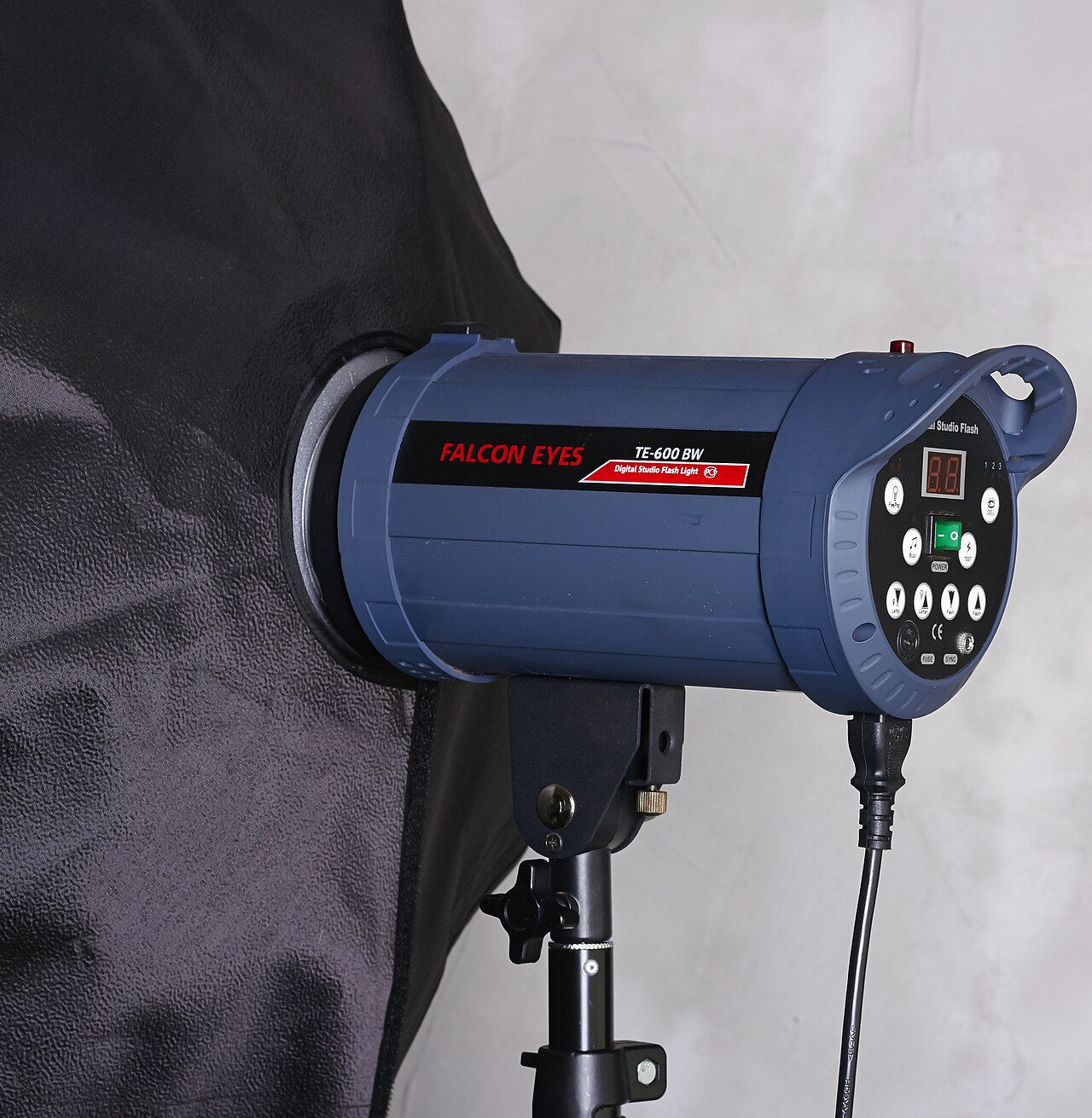 A studio flash head with a softbox attached
